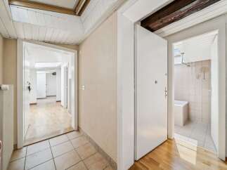 Step into this inviting hallway featuring a bright and airy atmosphere, perfect for a welcoming entrance.