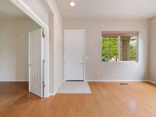 Step into this inviting entryway featuring a bright white front door and a convenient interior door leading to additional living space.