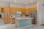 This spacious kitchen features ample natural light and a functional layout, perfect for any home chef.