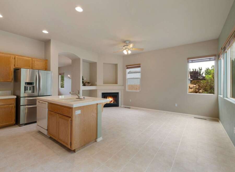 Experience comfortable living in this open-concept home featuring a modern kitchen with stainless steel appliances and a convenient island.