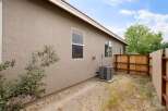 Discover this charming home featuring a neutral-toned stucco exterior and a durable roof.