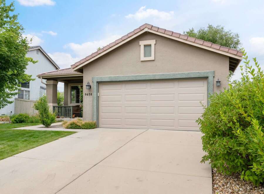 Discover this charming home featuring a spacious two-car garage and a welcoming covered porch.