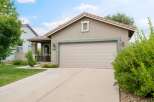 Discover this charming home featuring a spacious two-car garage and a welcoming covered porch.