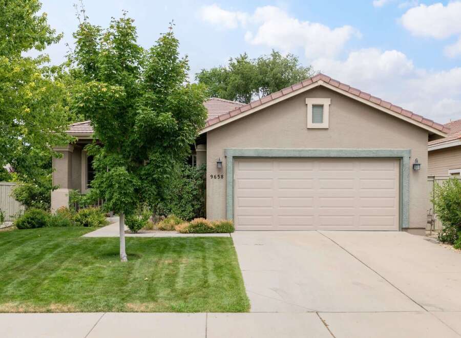 Discover this charming single-family home featuring a well-maintained lawn and mature trees, offering a welcoming curb appeal.