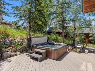 Relax and unwind in this luxurious hot tub, perfectly situated on a spacious wooden deck.