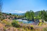 Enjoy outdoor recreation with this private tennis court, perfect for a friendly match or practice.