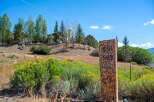 Discover this stunning property with a beautiful stone marker displaying house numbers 551 and 553.