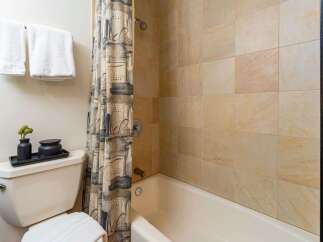 This bathroom features a clean and modern aesthetic with a neutral color palette.