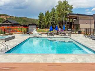 Experience luxury outdoor living with this stunning swimming pool and spa area, perfect for relaxation and entertainment.