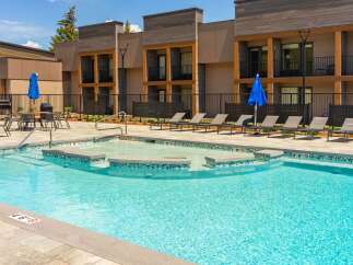 Experience luxury outdoor living with this stunning swimming pool and spa area, perfect for relaxation and entertainment.