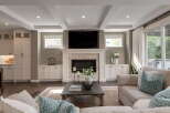 Experience modern living in this beautifully appointed living room, featuring a stunning stone fireplace as the focal point.