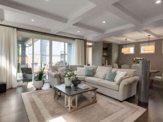 Experience luxurious living in this spacious great room, featuring a large sectional sofa perfect for gatherings.