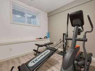 Transform your home into a personal fitness sanctuary with this dedicated gym space.