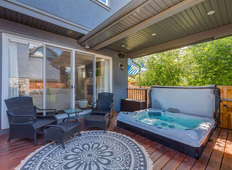 Enjoy ultimate relaxation in this backyard oasis, featuring a luxurious hot tub perfect for unwinding.