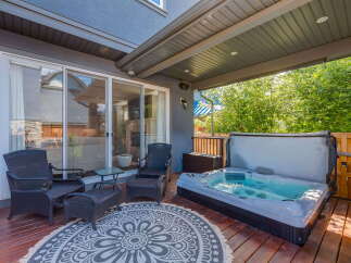 Enjoy ultimate relaxation in this backyard oasis, featuring a luxurious hot tub perfect for unwinding.