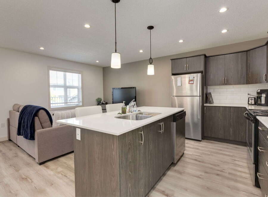 Experience modern living in this open-concept kitchen and living area.