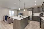 Experience modern living in this open-concept kitchen and living area.