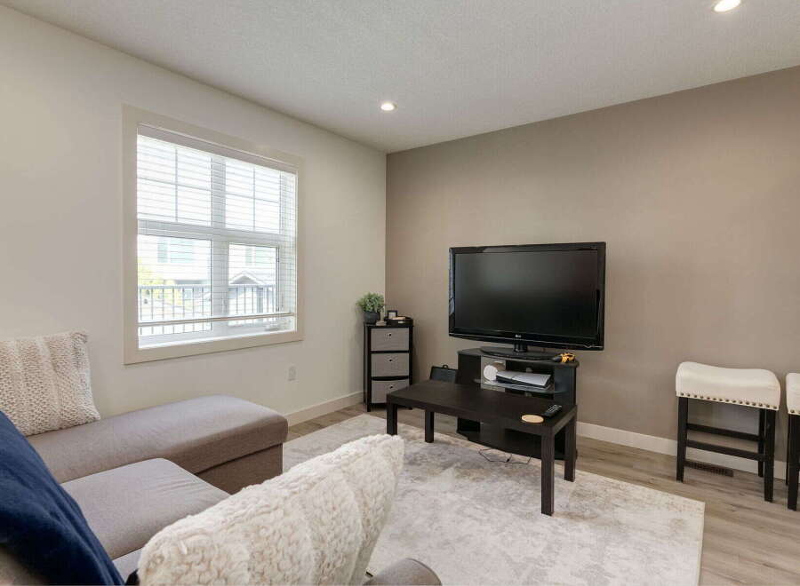 Step into this inviting living room, featuring a comfortable sectional sofa perfect for relaxation and entertainment.