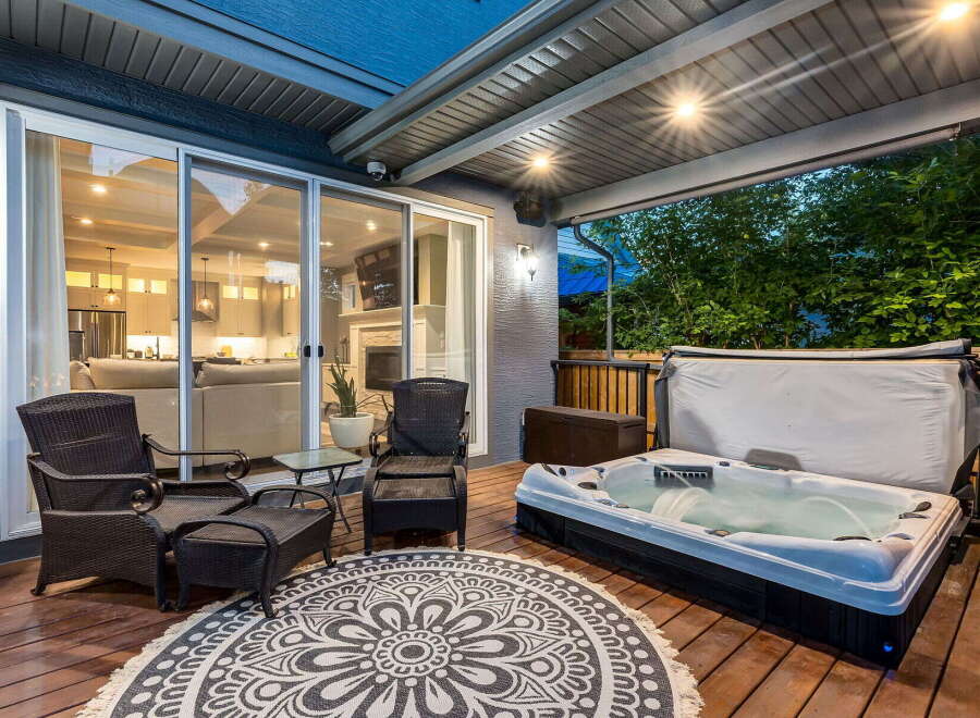 Enjoy ultimate relaxation on this spacious deck, featuring a luxurious hot tub perfect for unwinding.