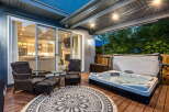 Enjoy ultimate relaxation on this spacious deck, featuring a luxurious hot tub perfect for unwinding.