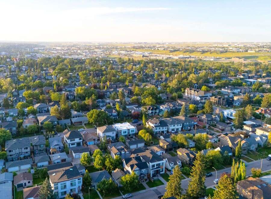 Discover this charming suburban neighborhood, featuring a variety of well-maintained homes nestled among mature trees.