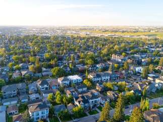 Discover this charming suburban neighborhood, featuring a variety of well-maintained homes nestled among mature trees.