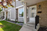 Charming townhouse exterior featuring a welcoming brick facade with house number 292.