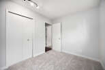 Step into this freshly painted bedroom, featuring plush carpeting and ample closet space.