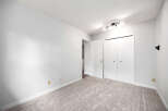 Step into this inviting room featuring plush carpeting and clean white walls, creating a serene atmosphere.