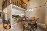 Experience the charm of this unique home featuring a lofted bedroom overlooking a spacious living area.