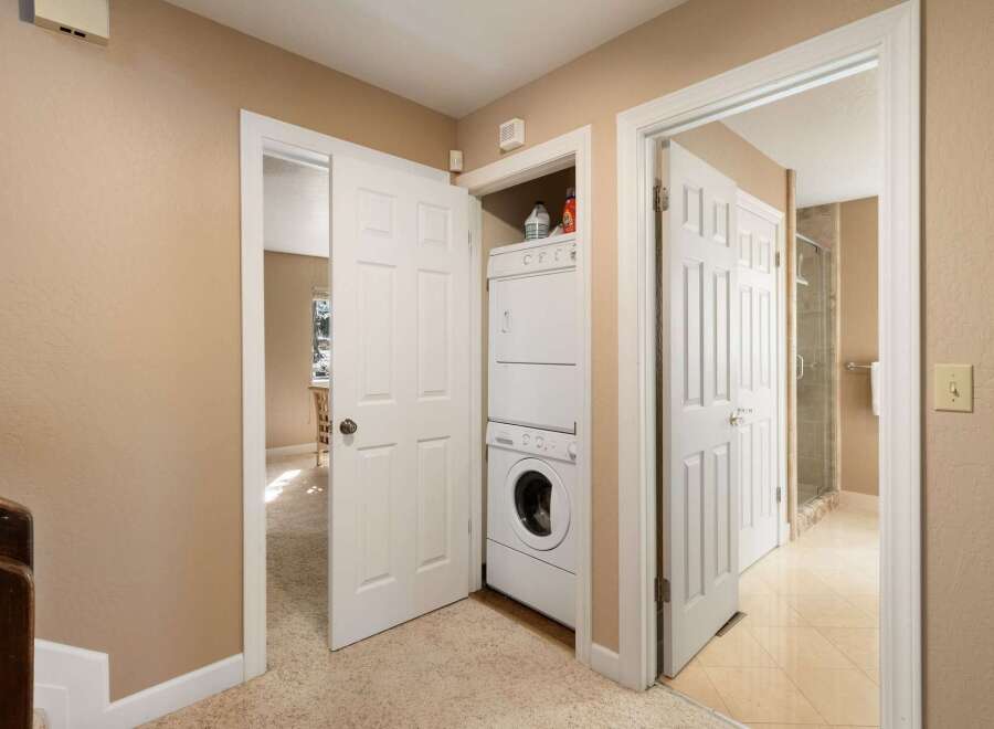 Discover convenient in-unit laundry facilities with a stacked washer and dryer, perfect for modern living.