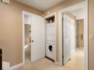 Discover convenient in-unit laundry facilities with a stacked washer and dryer, perfect for modern living.