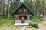 Charming A-frame cabin nestled in a serene forest setting, perfect for a mountain getaway.