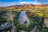 Experience serene waterfront living with this stunning aerial view of a tranquil lake, perfect for water activities and relaxation.