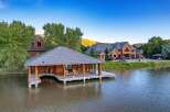 Experience luxury living with this stunning waterfront property, featuring a private boathouse and expansive lake views.