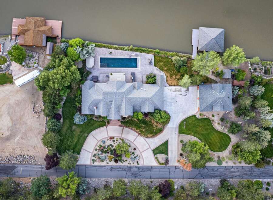 Experience luxury waterfront living in this stunning estate featuring a private pool and direct access to the water.