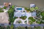 Experience luxury waterfront living in this stunning estate featuring a private pool and direct access to the water.
