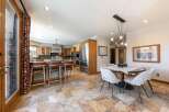 Experience the perfect blend of style and functionality in this spacious kitchen and dining area.