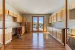 Discover ample storage and workspace in this home featuring extensive custom cabinetry and built-in desks.