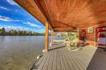 Enjoy breathtaking waterfront living from this stunning covered deck, perfect for relaxing and entertaining.