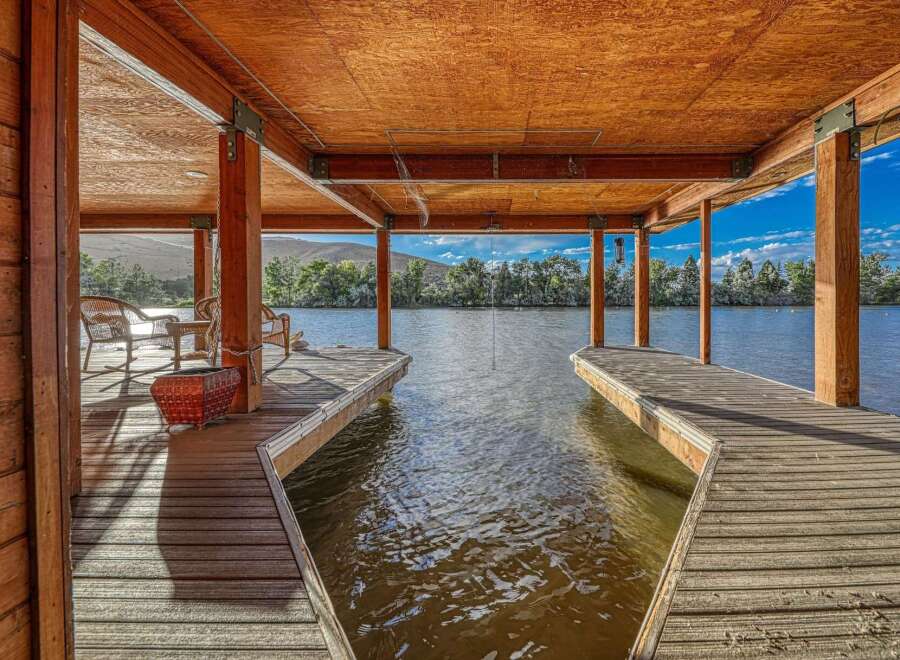 Enjoy waterfront living with this stunning property featuring a private dock and covered boat slip.