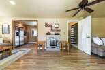 Step into this charming living space featuring a cozy fireplace and rustic wooden accents.