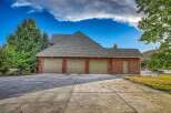 This stunning property boasts a spacious three-car garage, perfect for car enthusiasts or those needing extra storage.