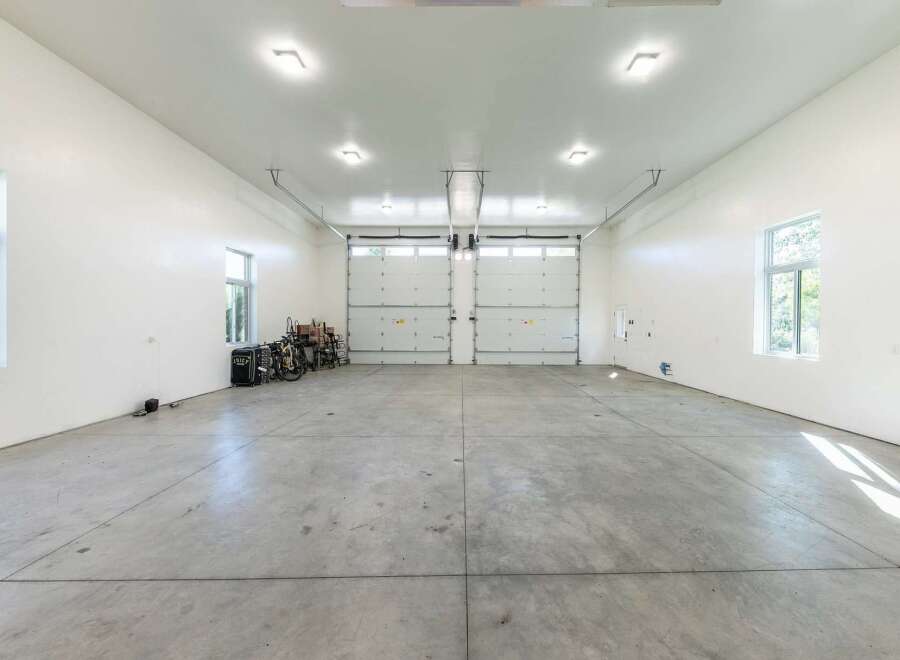 This spacious garage offers ample room for multiple vehicles and storage.