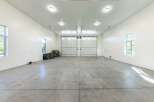 This spacious garage offers ample room for multiple vehicles and storage.