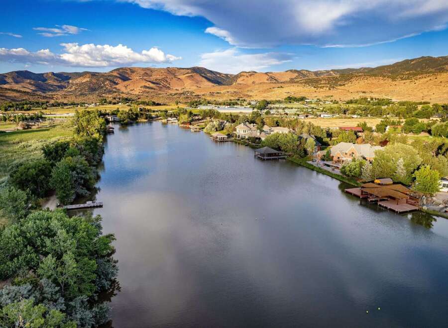 Experience luxury lakeside living with this stunning property featuring a private dock and boathouse, perfect for water enthusiasts.