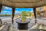 Experience luxury outdoor living with this stunning property featuring a sparkling swimming pool and a relaxing fire pit area, perfect for entertaining.