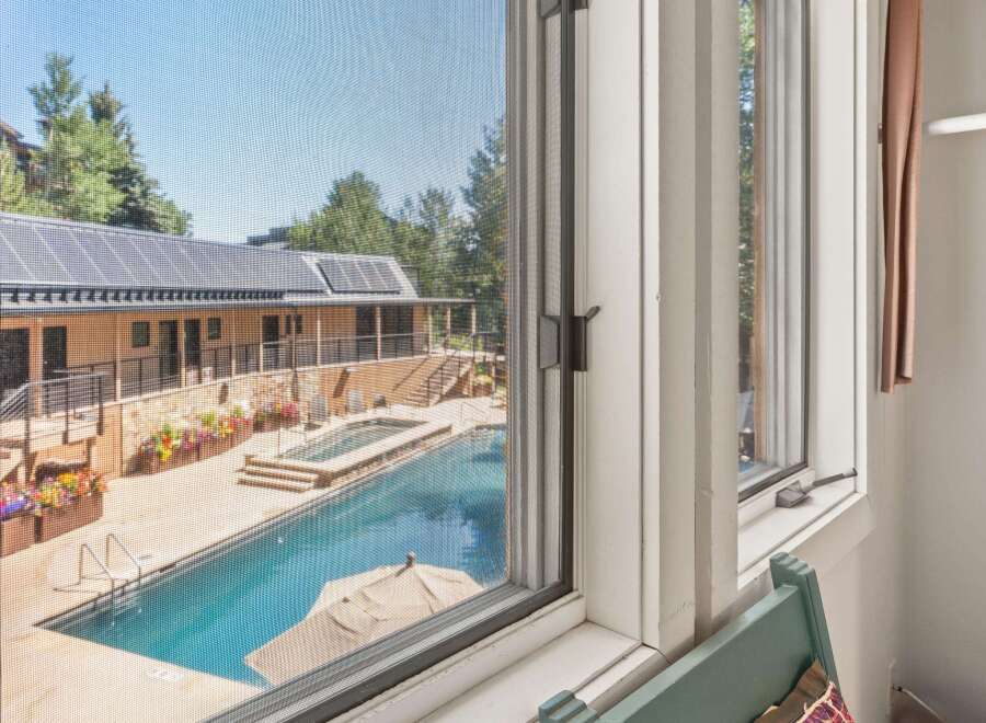 Experience luxury living with this stunning property featuring a sparkling swimming pool and an inviting hot tub, perfect for relaxation and entertainment.
