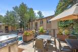 Enjoy outdoor living at its finest on this spacious balcony, complete with a stainless steel grill and comfortable seating.