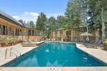 Enjoy a refreshing dip in this stunning outdoor swimming pool, complete with a relaxing hot tub.